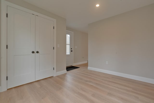 foyer with light wood-type flooring