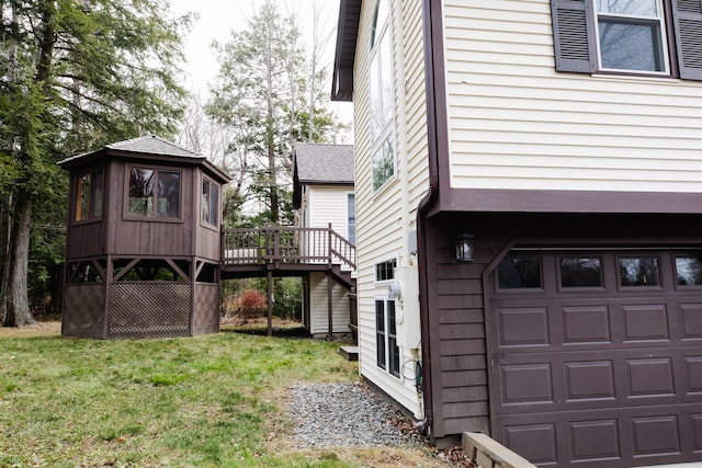 view of home's exterior with a yard and a deck