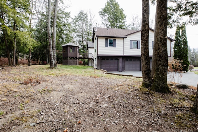 view of side of property with a garage