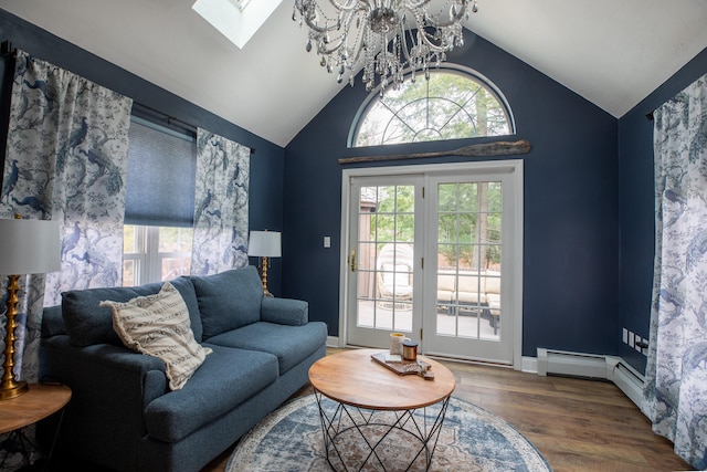 living room featuring hardwood / wood-style floors, lofted ceiling, and a notable chandelier