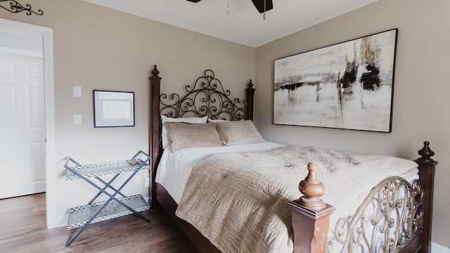 bedroom featuring hardwood / wood-style flooring and ceiling fan