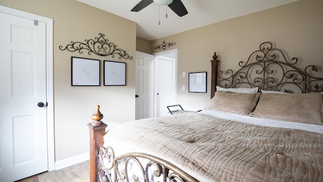 bedroom featuring light hardwood / wood-style flooring and ceiling fan