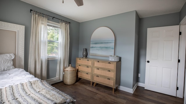 bedroom with ceiling fan and dark wood-type flooring