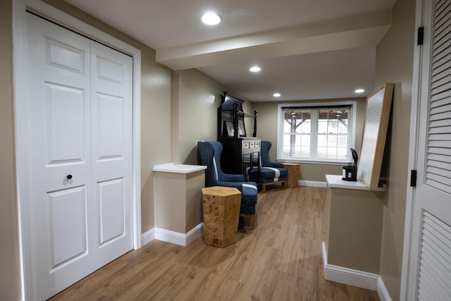 sitting room with wood-type flooring