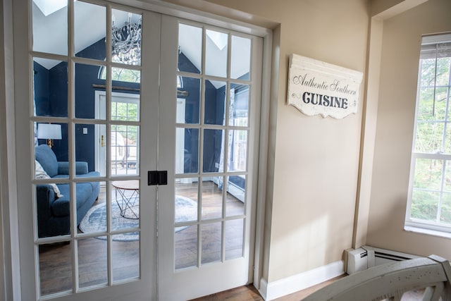 doorway with baseboard heating and french doors