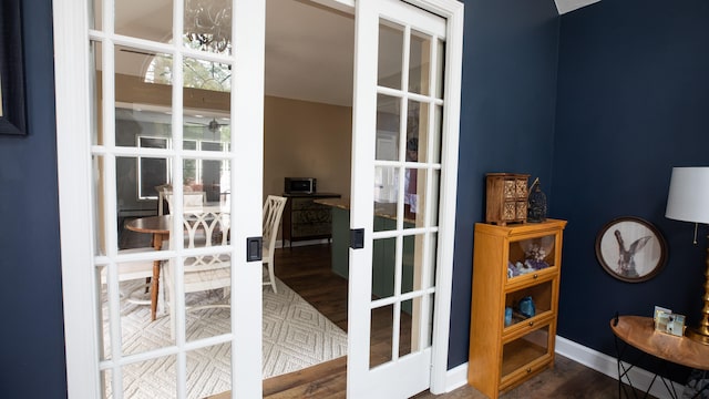 doorway featuring dark hardwood / wood-style flooring and french doors