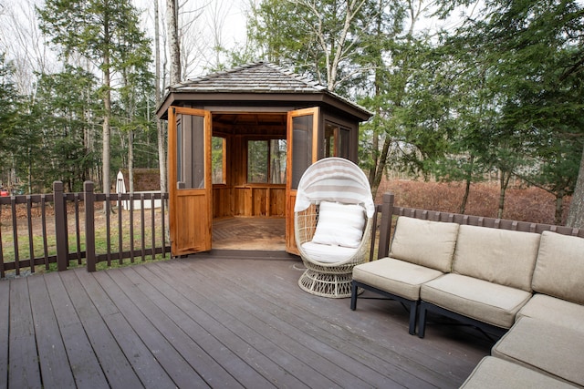 deck featuring a gazebo and an outdoor living space