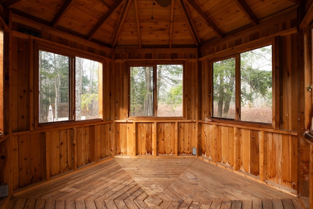 unfurnished sunroom featuring lofted ceiling with beams and wood ceiling