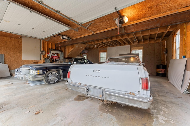 garage featuring a garage door opener and a carport