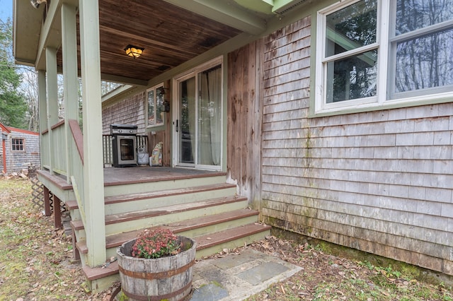 property entrance featuring covered porch