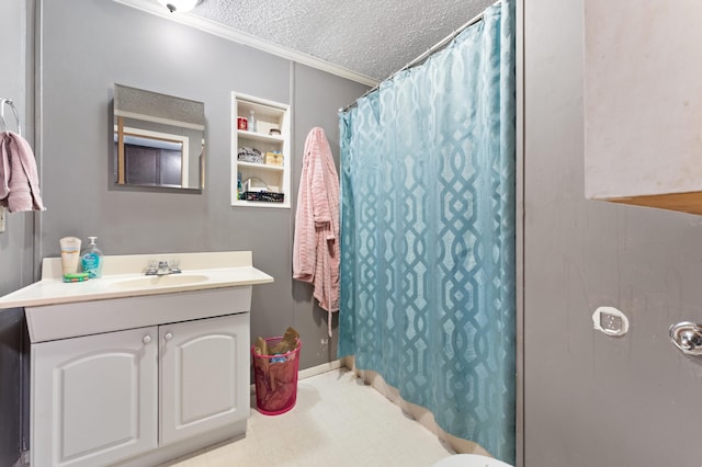 bathroom featuring vanity, curtained shower, crown molding, and a textured ceiling