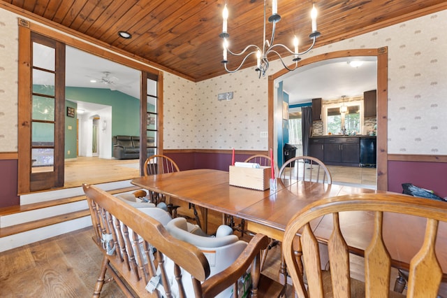 dining room with hardwood / wood-style flooring, vaulted ceiling, ceiling fan, and wood ceiling