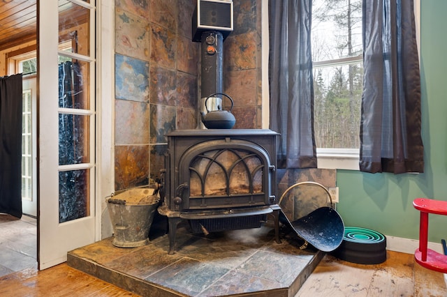 interior details featuring hardwood / wood-style flooring and a wood stove