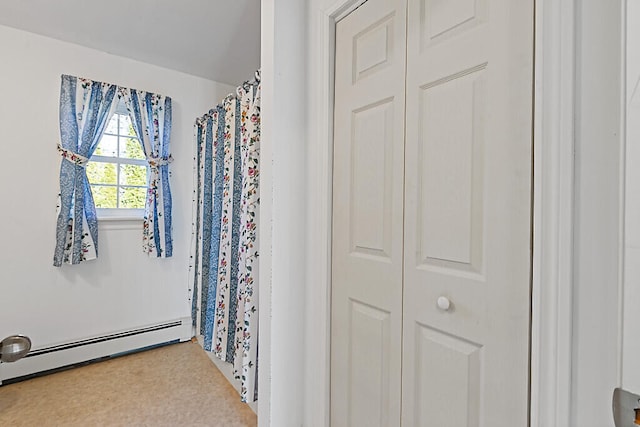 bathroom with a baseboard radiator