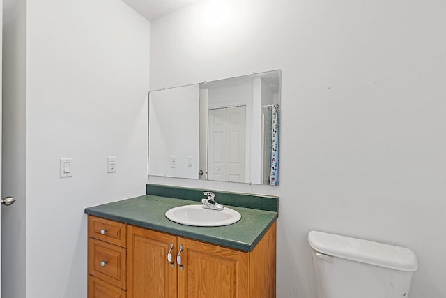 bathroom with vanity and toilet