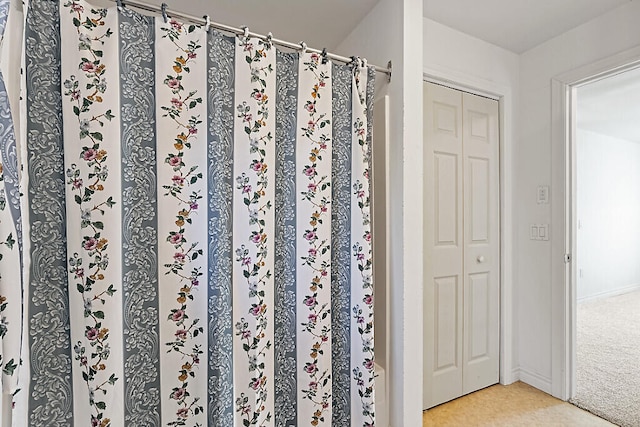 bathroom featuring a shower with curtain