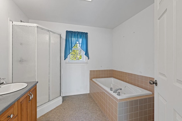 bathroom with vanity and separate shower and tub