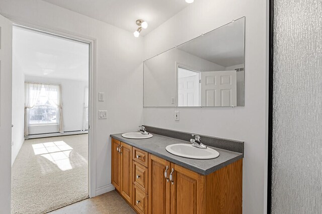 bathroom featuring vanity and a baseboard heating unit