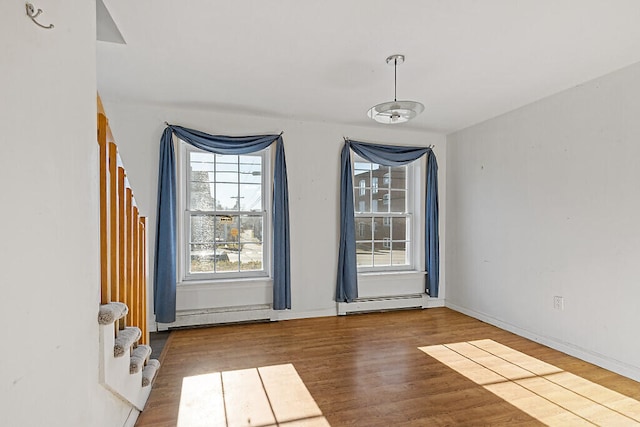 spare room featuring hardwood / wood-style floors