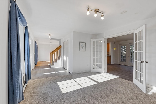 unfurnished room featuring french doors and hardwood / wood-style flooring