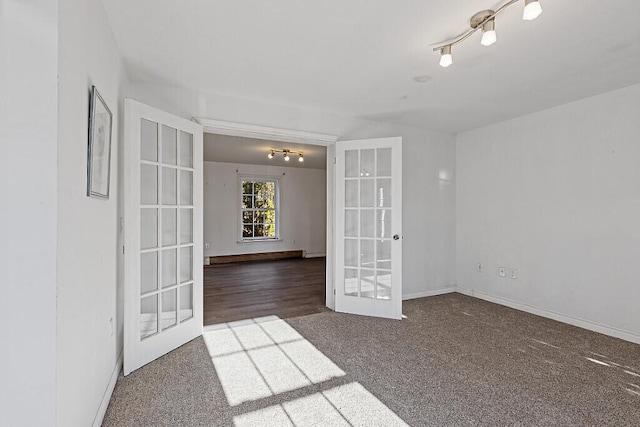 unfurnished room with french doors and dark hardwood / wood-style floors