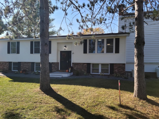 2 Old County Rd, Veazie, ME 04401 - raised ranch with a front lawn, a chimney, and brick siding