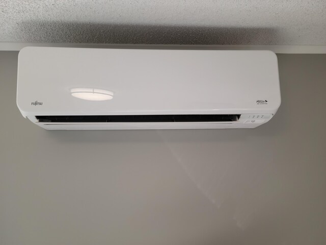 2 Old County Rd, Veazie, ME 04401 - detailed view of an AC wall unit and a textured ceiling