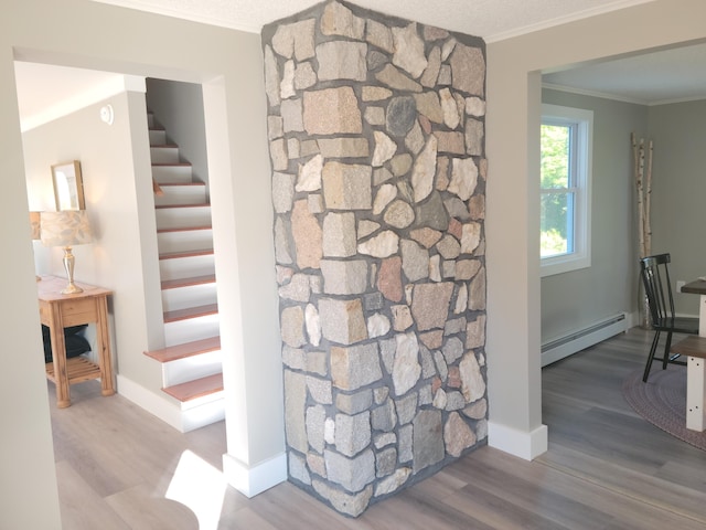 2 Old County Rd, Veazie, ME 04401 - stairway featuring baseboard heating, ornamental molding, wood finished floors, and baseboards