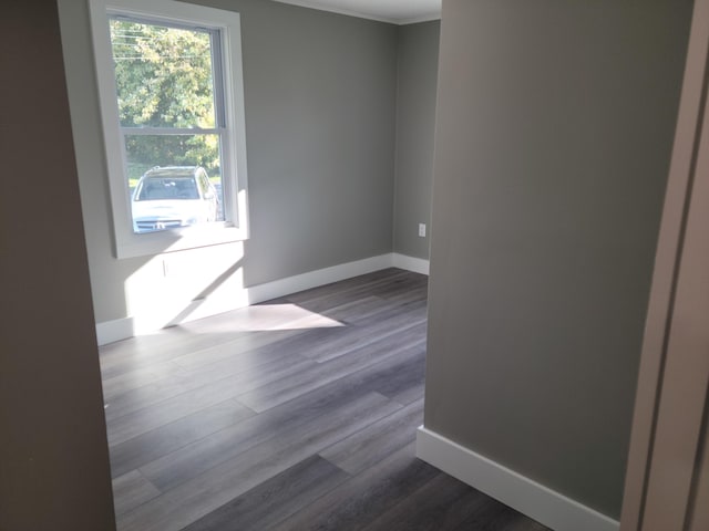 2 Old County Rd, Veazie, ME 04401 - spare room with dark wood-type flooring, baseboards, and crown molding