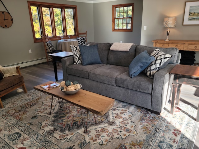 2 Old County Rd, Veazie, ME 04401 - living area with a baseboard heating unit and wood finished floors