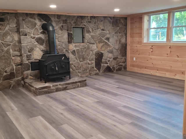 2 Old County Rd, Veazie, ME 04401 - unfurnished living room featuring a wood stove, wood finished floors, recessed lighting, and electric panel