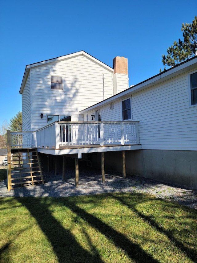 2 Old County Rd, Veazie, ME 04401 - back of property with stairs, a wooden deck, a chimney, and a yard