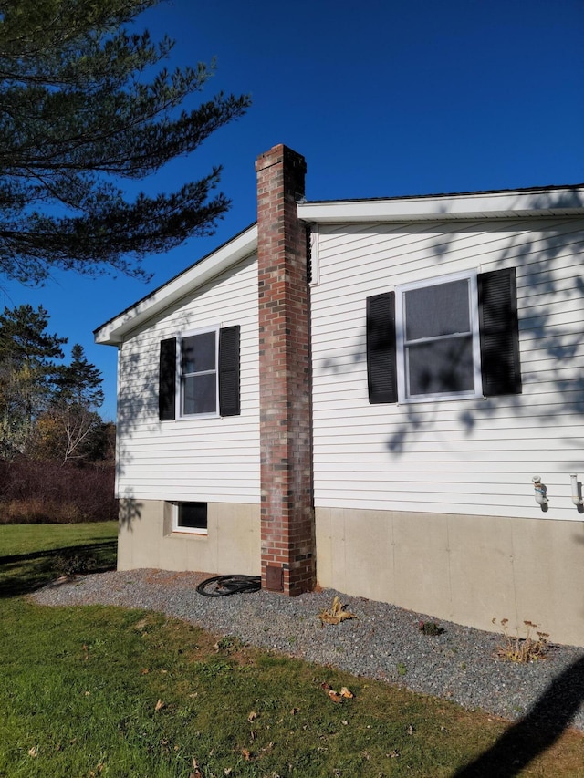 2 Old County Rd, Veazie, ME 04401 - view of home's exterior with a chimney and a yard