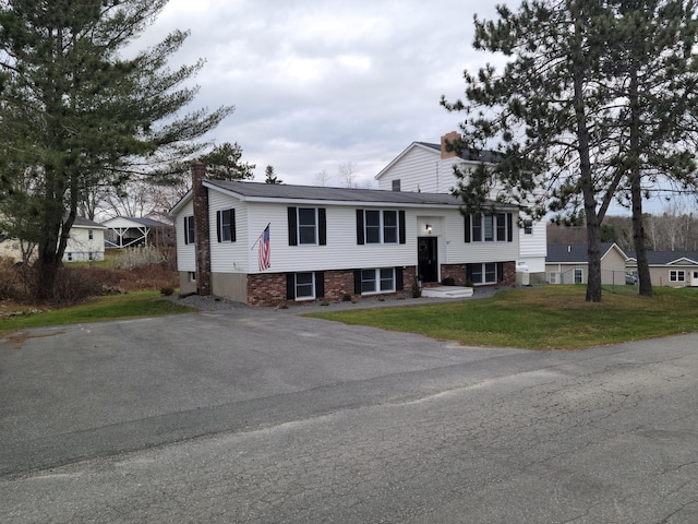 2 Old County Rd, Veazie, ME 04401 - split foyer home featuring a chimney and a front yard