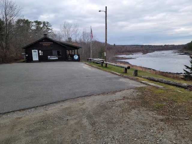 2 Old County Rd, Veazie, ME 04401 - view of asphalt driveway featuring street lighting and a water view