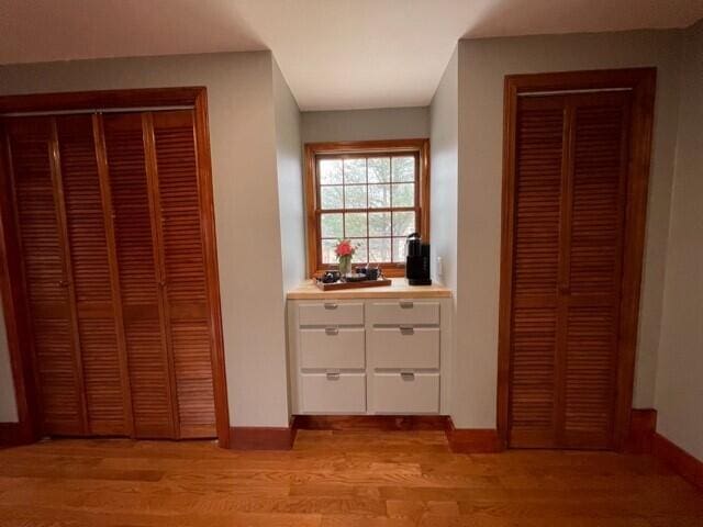 2 Old County Rd, Veazie, ME 04401 - unfurnished bedroom with light wood-type flooring, baseboards, and a closet