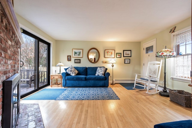 living room featuring hardwood / wood-style floors and a fireplace