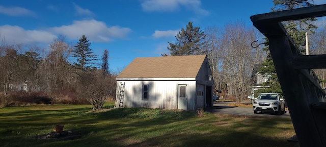 view of outdoor structure with a lawn