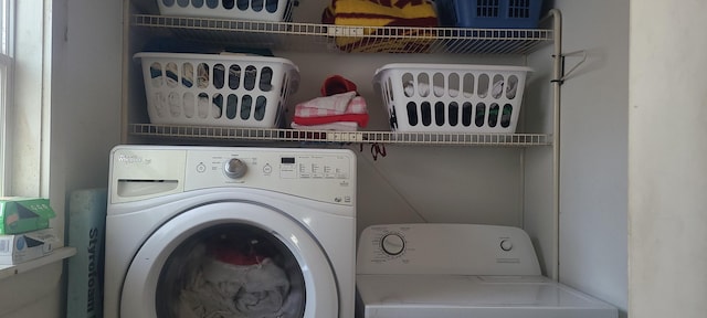 laundry area with washing machine and clothes dryer