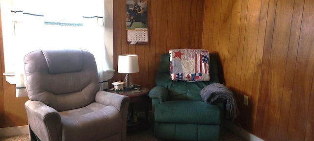 sitting room with wood walls