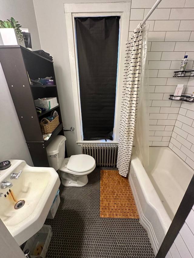 full bathroom featuring radiator, sink, shower / bathtub combination with curtain, tile patterned flooring, and toilet