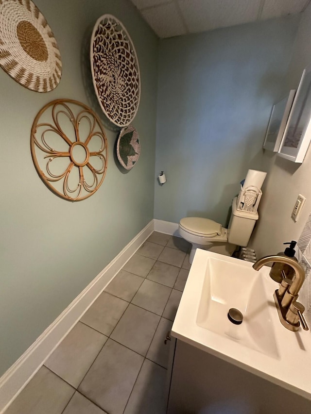 bathroom with tile patterned floors, vanity, and toilet