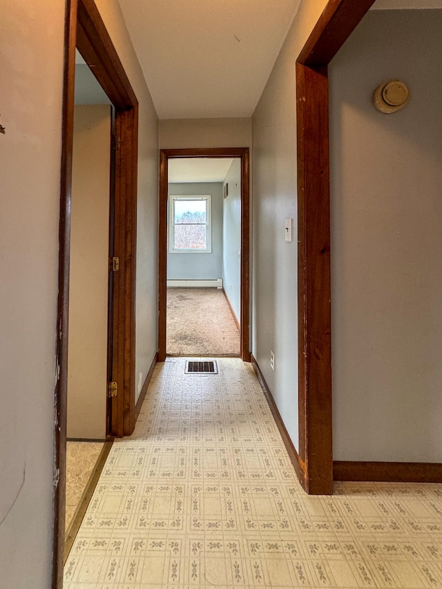 corridor featuring a baseboard radiator