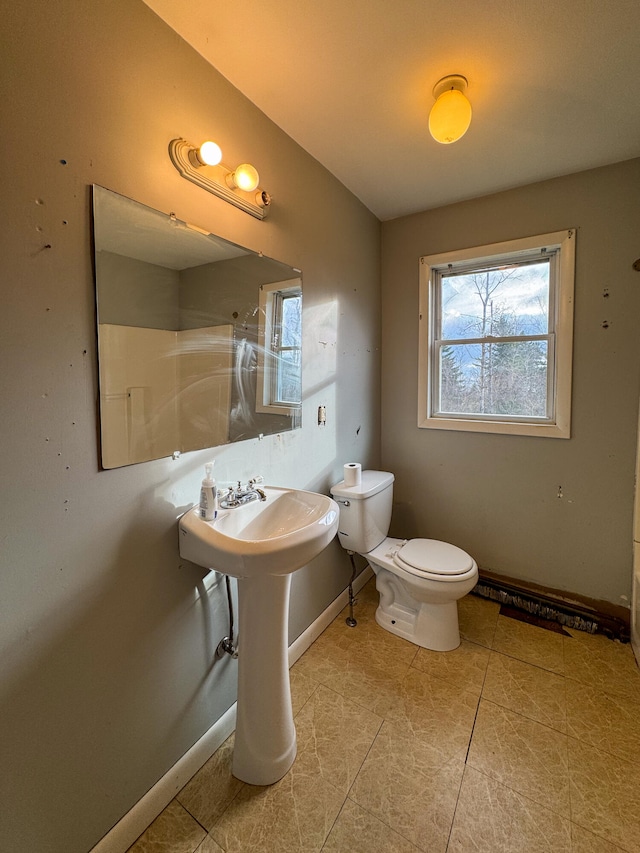 bathroom featuring tile patterned flooring and toilet