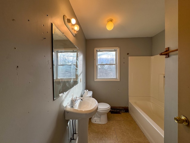 bathroom with tile patterned floors, toilet, and sink