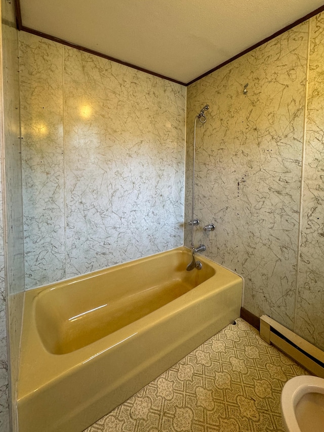 bathroom featuring crown molding, toilet, and a textured ceiling