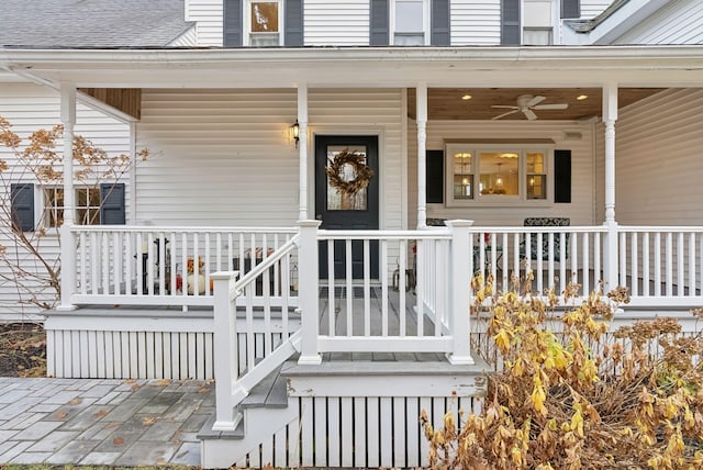 doorway to property featuring a porch and ceiling fan