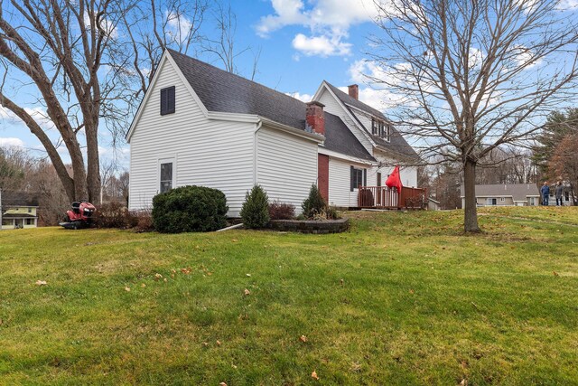 544 Main Rd N, Hampden, ME 04444 - view of side of home featuring a shingled roof, a chimney, and a yard