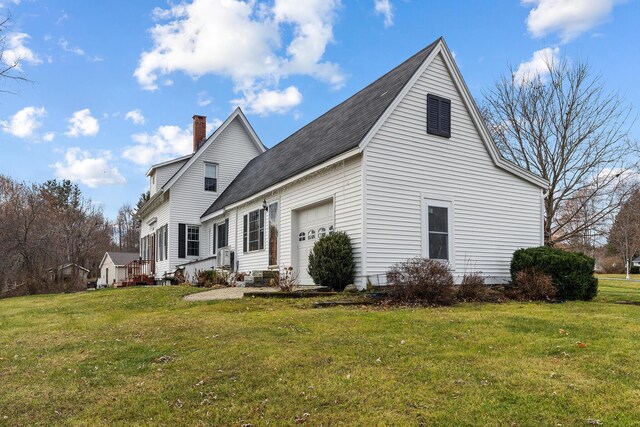 544 Main Rd N, Hampden, ME 04444 - view of property exterior with a lawn, an attached garage, roof with shingles, and a chimney