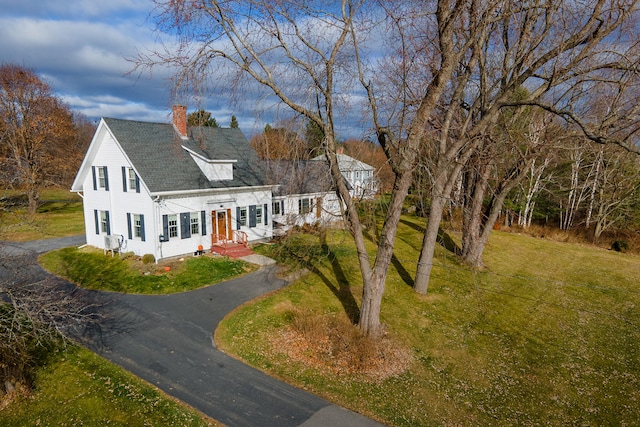 544 Main Rd N, Hampden, ME 04444 - view of front of home with driveway, a chimney, roof with shingles, and a front lawn
